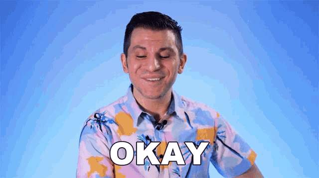 a man in a colorful shirt says okay