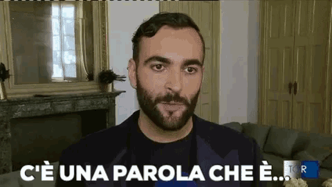 a man with a beard says c'e una parola che e.