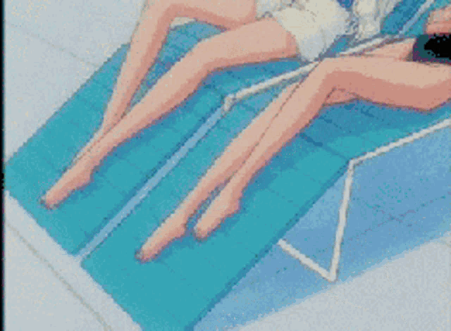 a pixelated image of two women laying on a chair