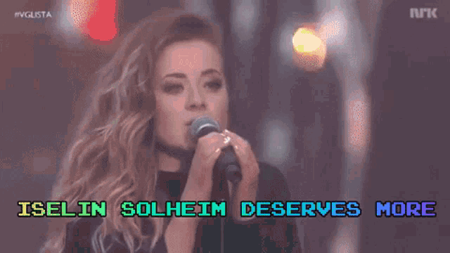 a woman singing into a microphone with the words iselin solheim deserves more on the screen
