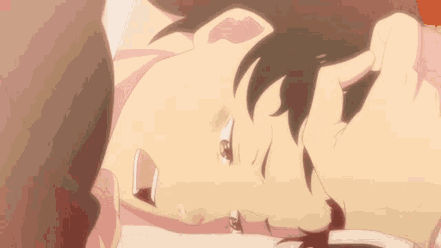 a close up of a person laying down with their eyes closed and their mouth open .