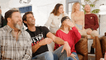 a man wearing a shirt that says ultra right laughs