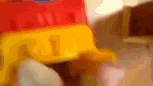 a blurred image of a red and yellow object with the number 31