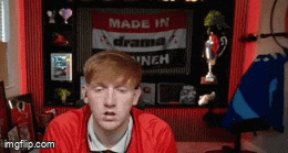 a man in front of a sign that says " made in drama "