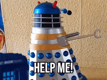 a toy dalek says help me in front of a police box