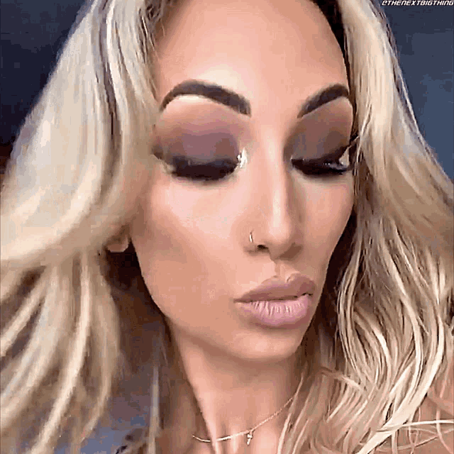 a close up of a woman 's face with the words " the next thing " on the bottom right