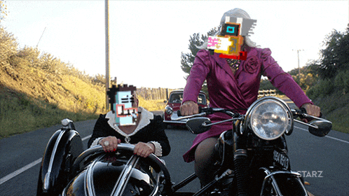 a woman in a pink dress is riding a motorcycle with a sidecar
