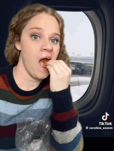 Caroline Easom Eating GIF - Caroline Easom Eating Airplane GIFs