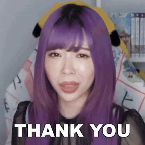 a girl with purple hair is giving a thank you sign