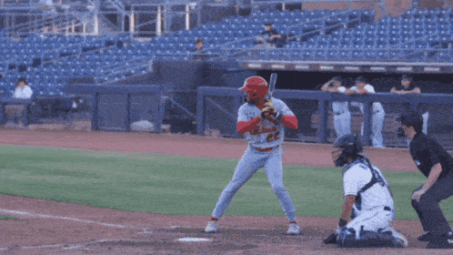 a baseball player with the number 23 on his jersey is running