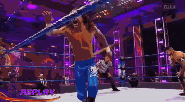 a man in a wrestling ring with the word replay on it