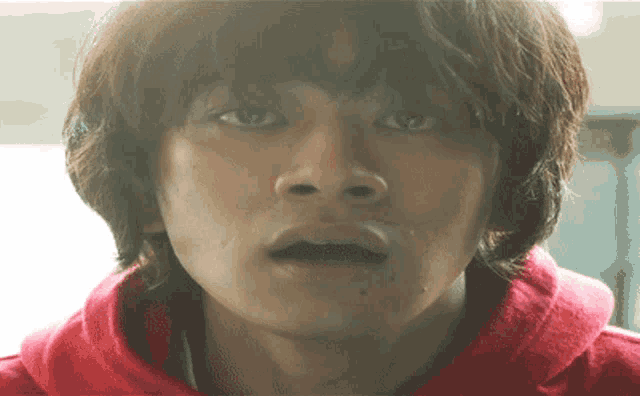 a close up of a person 's face with their mouth open