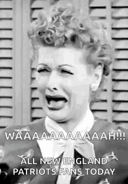 a black and white photo of a woman crying with her mouth open .