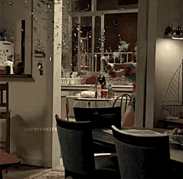 a gif of a woman in a kitchen with the hashtag jupaivagifs at the bottom