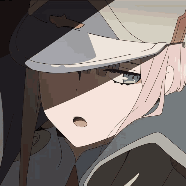 a close up of a girl with a hat on