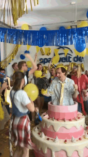 a group of people are dancing in front of a sign that says spa