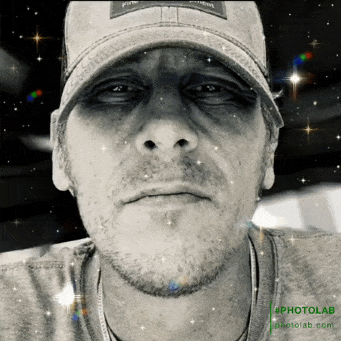 a black and white photo of a man 's face with the hashtag #photolab on the bottom