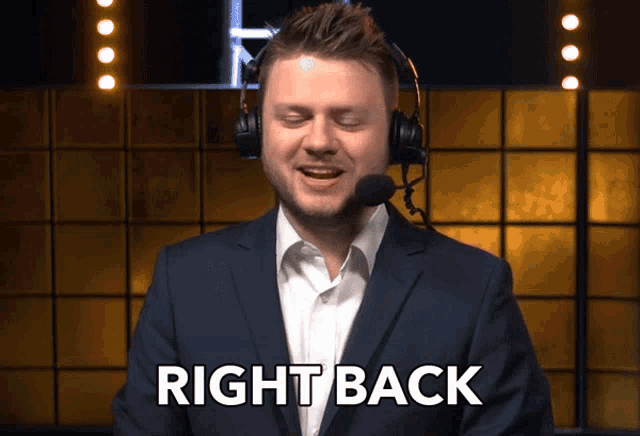 a man wearing a suit and headphones says right back
