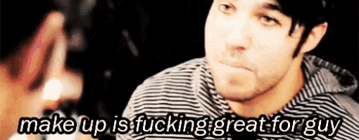a man in a striped shirt with the words make up is fucking great for guy