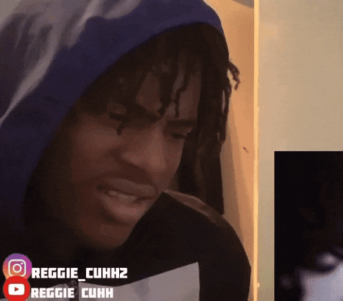 a man wearing a blue hoodie has the name reggie cuhh on the bottom right