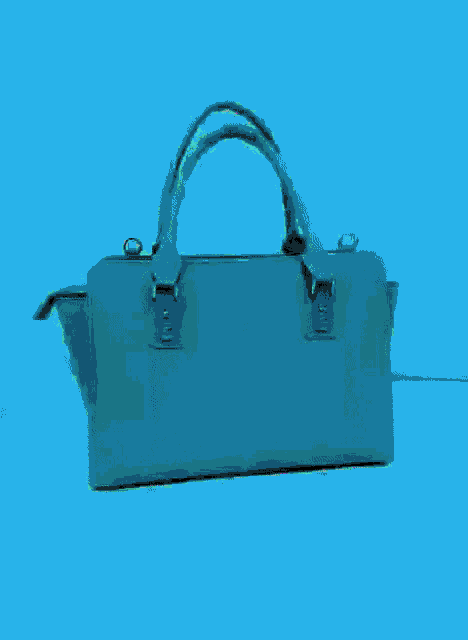 a turquoise colored purse with a black handle and a zipper