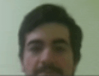 a blurry photo of a man 's face with a beard