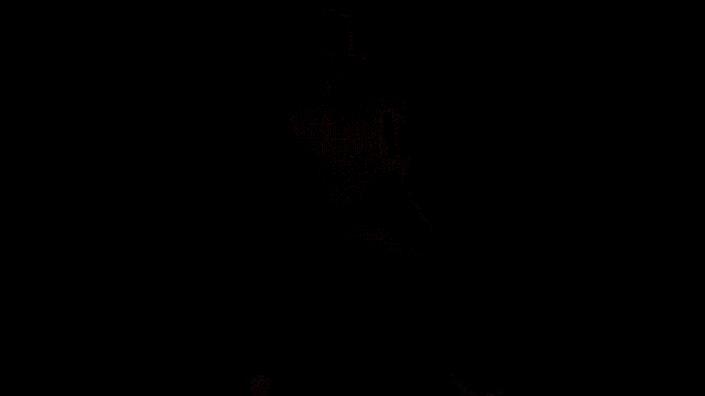 a man in a red shirt is dancing in a dark room