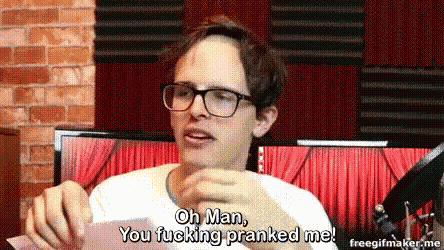 a man wearing glasses is holding a piece of paper and saying oh man you fucking pranked me .