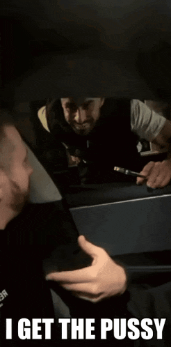 a man in a car with the words " i get the pussy "