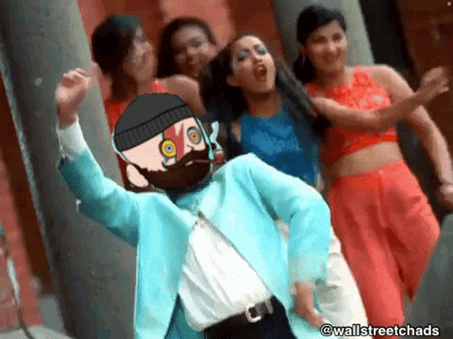 a group of women are dancing in front of a man with a beard and mustache