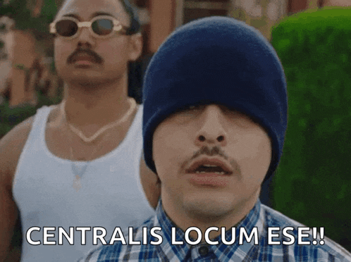 a man wearing a blue hat says centralis locum ese !
