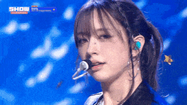 a close up of a woman 's face with the words show on the bottom left
