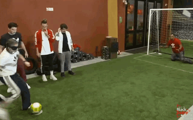 a group of people are playing soccer on a field that says " black friday " on the bottom
