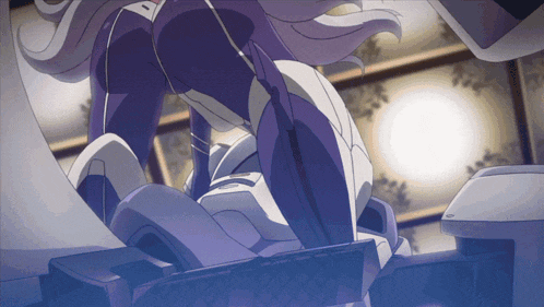 a woman in a purple suit is sitting on a chair