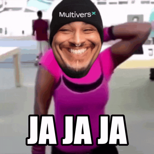 a man wearing a black multivers hat and a pink shirt