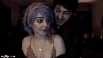 a man and a woman are looking at each other and the woman is saying adorable