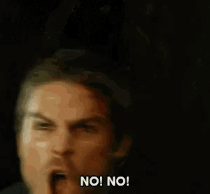 a man in a suit and tie is making a funny face and says no ! no !