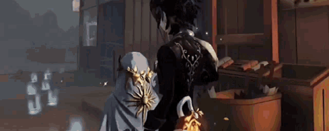 a man and woman are standing next to each other in a room .