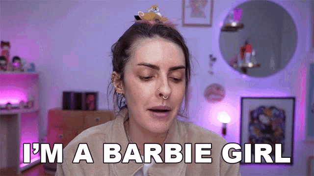 a woman is saying i 'm a barbie girl in a room