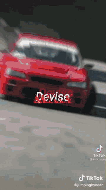 a red car with the word devise written on it