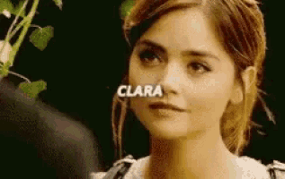 a close up of a woman 's face with the name clara written on it .