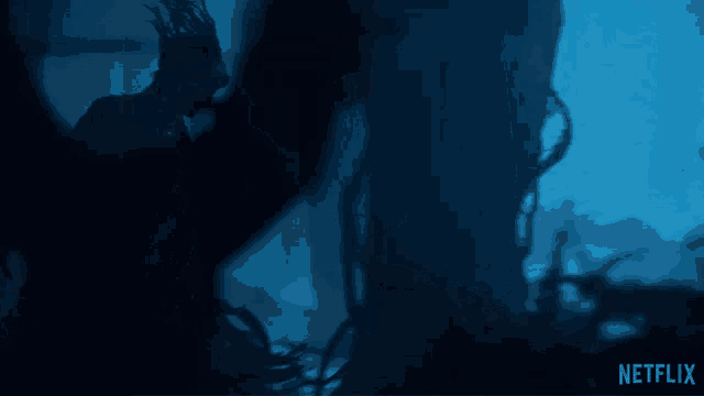 a netflix advertisement shows a person in a dark forest