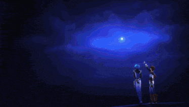 a couple of people standing in front of a blue sky