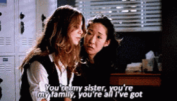two women are sitting next to each other and one of them is saying you 're my sister , you 're my family