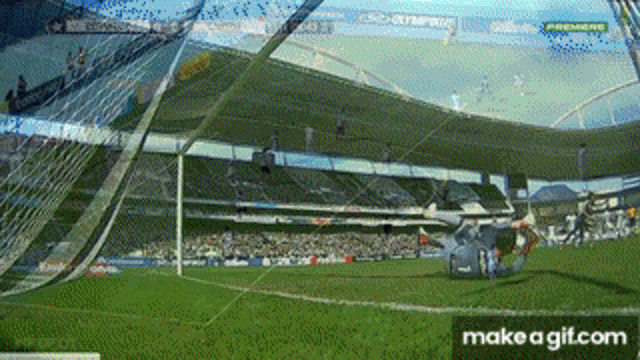 a soccer game is being played in a stadium with a make a gif.com button