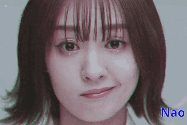 a close up of a woman 's face with the name nao on the bottom right