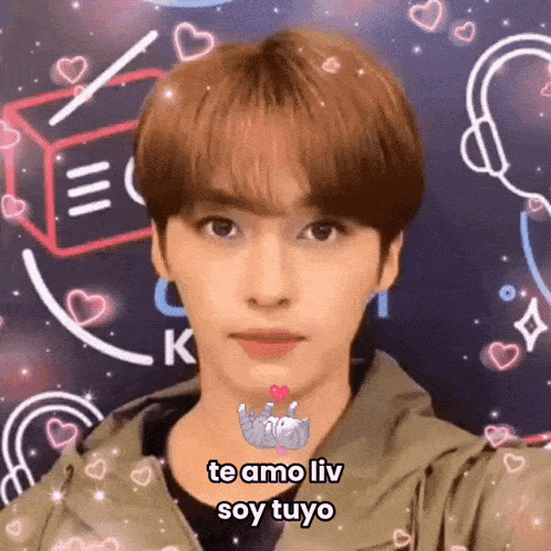 a close up of a person 's face with the words `` te amo liv soy tuyo '' written on the bottom .