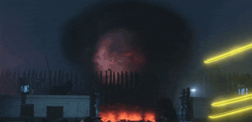a large red object is surrounded by glowing lights in a dark room