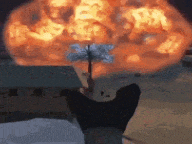 a dog is standing in front of a huge explosion while holding an umbrella .