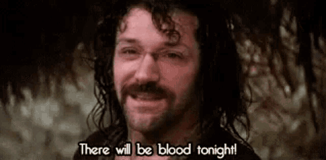 a man with a beard and mustache is smiling and saying there will be blood tonight .